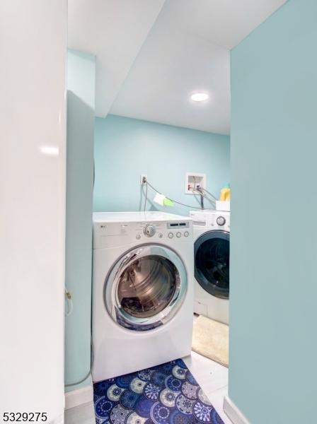 laundry area featuring washing machine and dryer