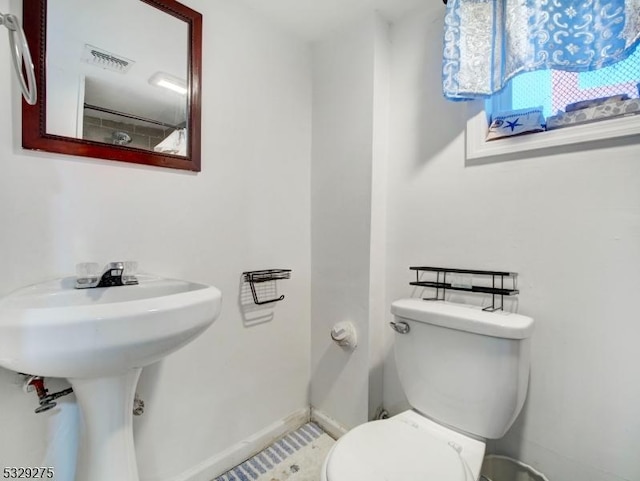 bathroom featuring sink and toilet