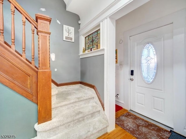 entryway with hardwood / wood-style floors