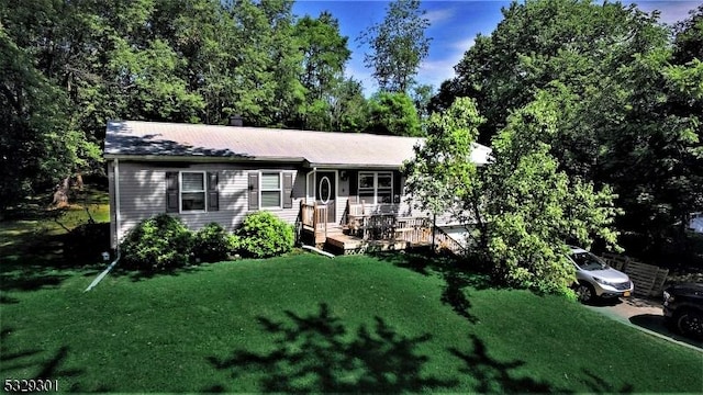 ranch-style home with a front lawn