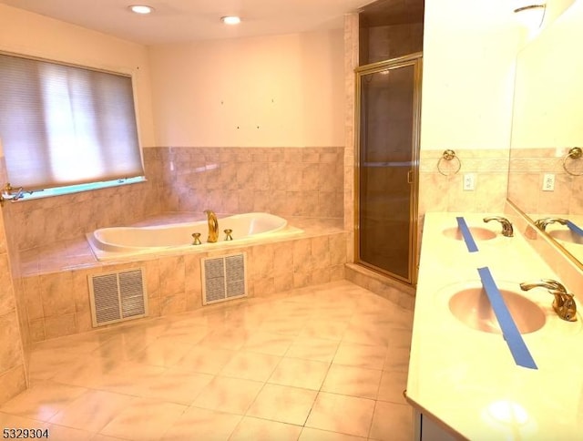 bathroom with vanity, tile patterned floors, and independent shower and bath