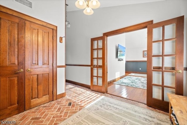 interior space featuring french doors and vaulted ceiling