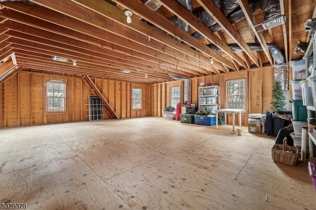 miscellaneous room featuring a healthy amount of sunlight and lofted ceiling