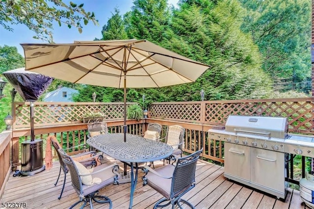 wooden deck featuring grilling area