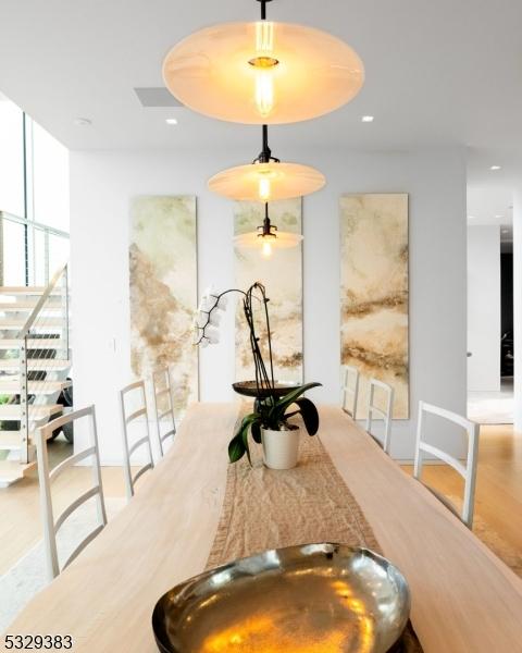 dining space with light wood-type flooring