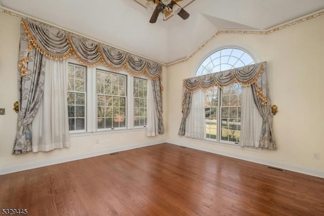 interior space with wood-type flooring, vaulted ceiling, and ceiling fan