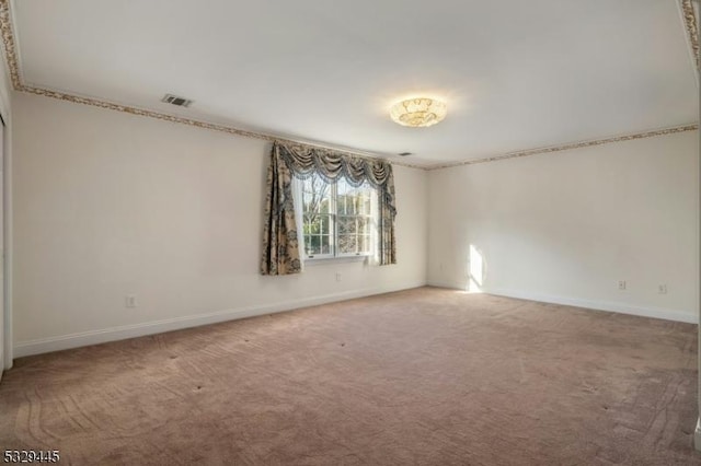 spare room featuring carpet flooring