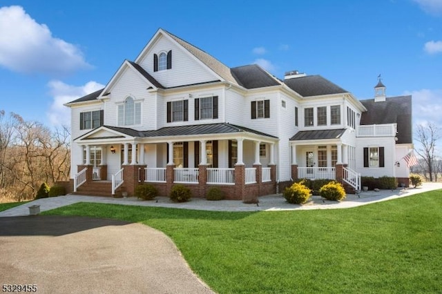 view of front of home with a porch and a front lawn