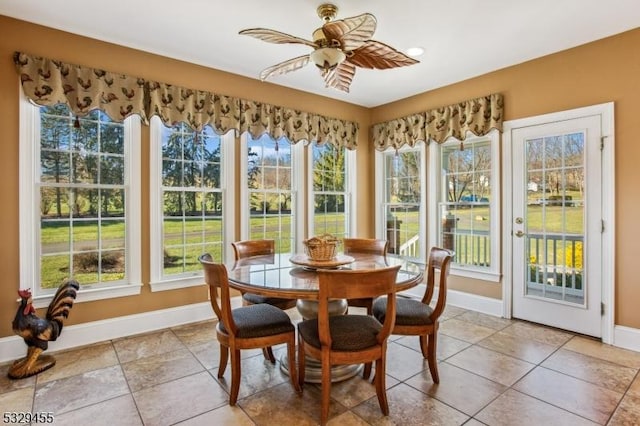 sunroom / solarium with plenty of natural light and ceiling fan