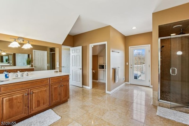 bathroom featuring vanity and an enclosed shower