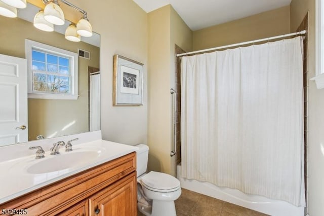 full bathroom featuring shower / bath combo, vanity, and toilet