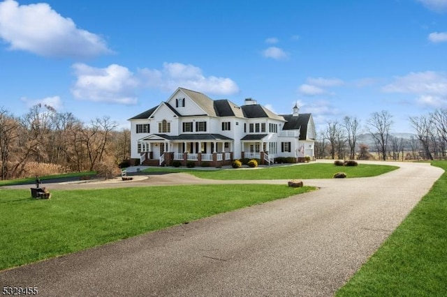 view of front facade with a porch and a front lawn