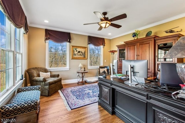 office area featuring crown molding, plenty of natural light, ceiling fan, and hardwood / wood-style flooring