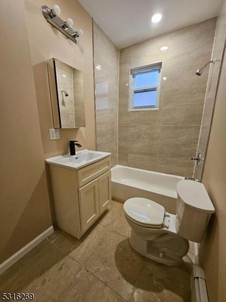 full bathroom featuring tile patterned floors, vanity, a baseboard heating unit, toilet, and tiled shower / bath