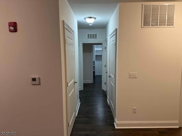 hallway featuring dark hardwood / wood-style floors