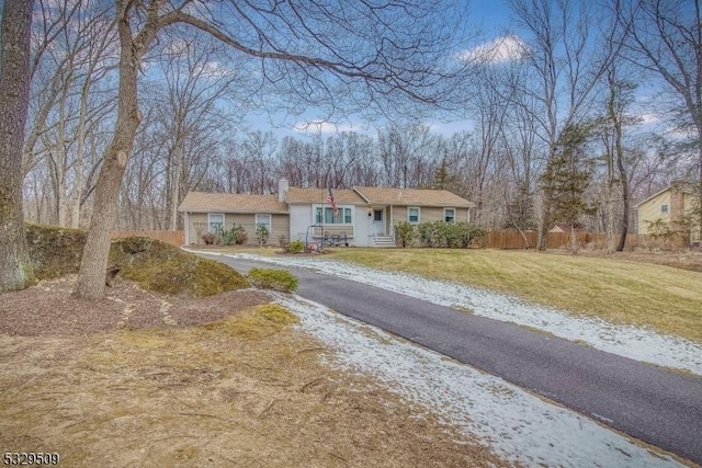 ranch-style home with a front yard