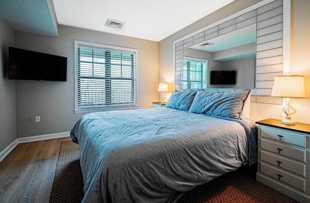 bedroom featuring dark hardwood / wood-style flooring