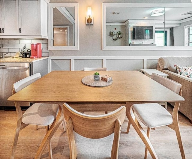 dining room with light hardwood / wood-style flooring