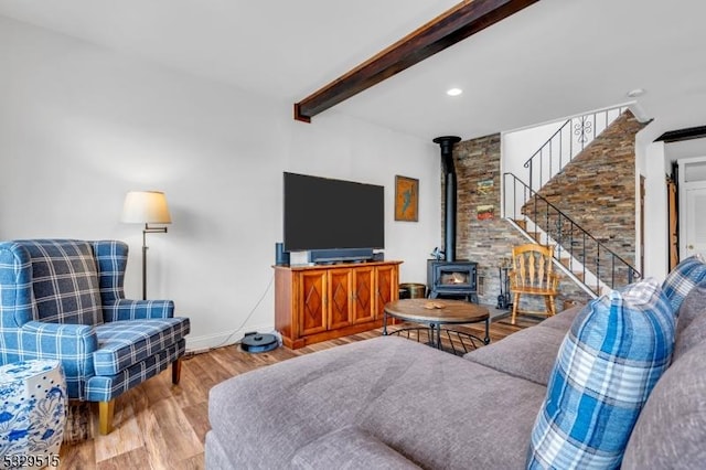 413B Lakeside Blvd, Hopatcong Boro, NJ 07843 - living room featuring wood finished floors, stairway, beamed ceiling, a wood stove, and baseboards