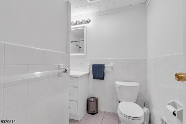 413B Lakeside Blvd, Hopatcong Boro, NJ 07843 - bathroom featuring tile walls, toilet, tile patterned floors, vanity, and wainscoting