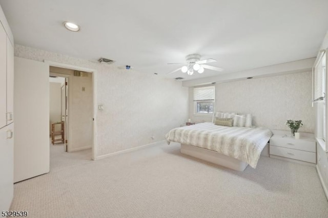 bedroom with light colored carpet and ceiling fan