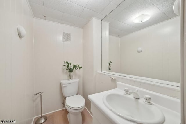 bathroom with sink, hardwood / wood-style flooring, and toilet