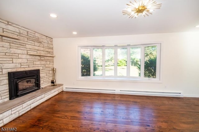 unfurnished living room with dark hardwood / wood-style flooring, a baseboard radiator, and a healthy amount of sunlight