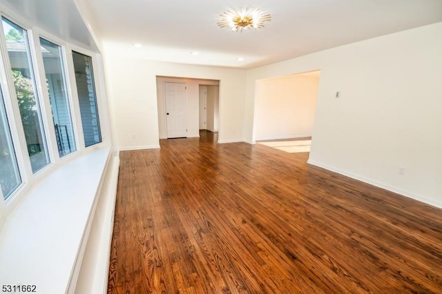 spare room with wood-type flooring