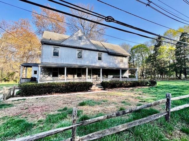 37 Dahmer Rd, Franklin Twp, NJ 08873 - exterior space featuring covered porch, fence, a yard, and stone siding