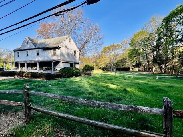 37 Dahmer Rd, Franklin Twp, NJ 08873 - view of side of home with a lawn and fence
