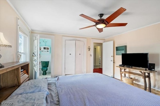 bedroom with crown molding and ceiling fan