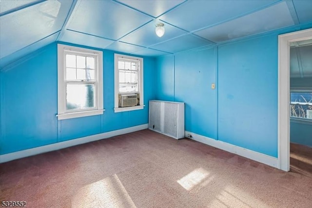 bonus room featuring cooling unit, lofted ceiling, radiator, and carpet