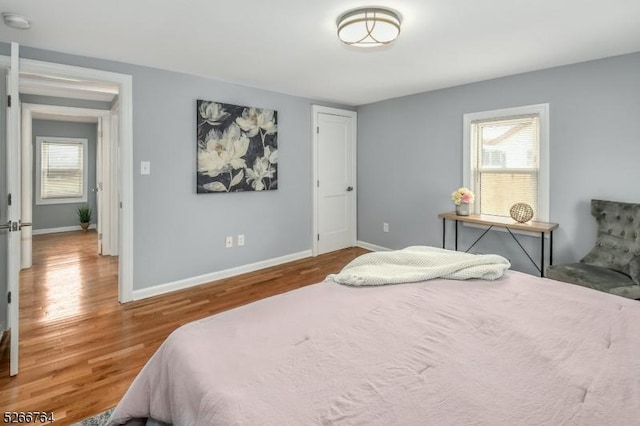 bedroom with hardwood / wood-style floors