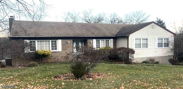 ranch-style home with a front lawn