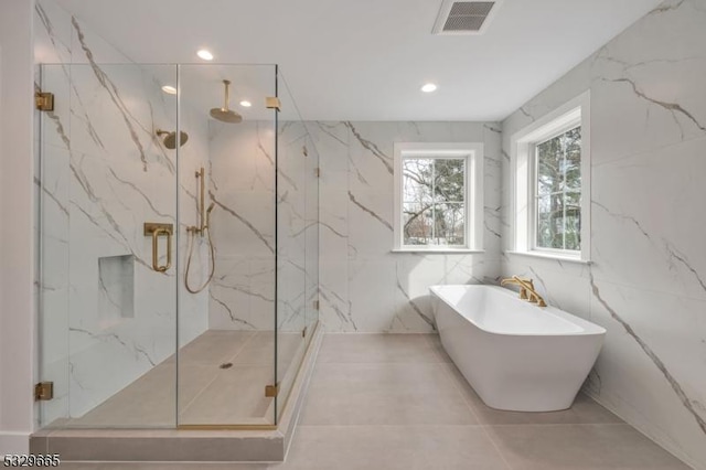 full bathroom with recessed lighting, visible vents, a freestanding bath, and a marble finish shower