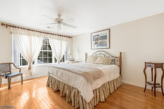 bedroom featuring ceiling fan and light hardwood / wood-style flooring