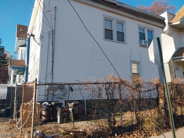 view of side of home featuring cooling unit