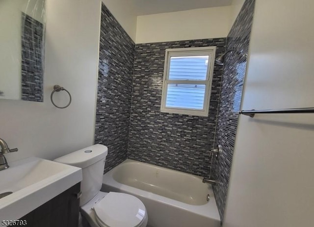 full bathroom with vanity, toilet, and tiled shower / bath