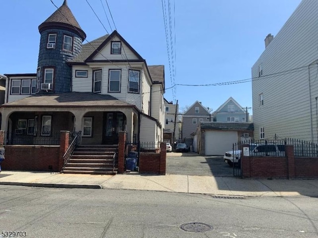 view of front of house featuring cooling unit and a porch