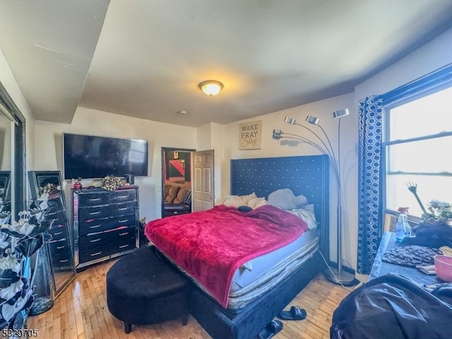 bedroom with wood-type flooring