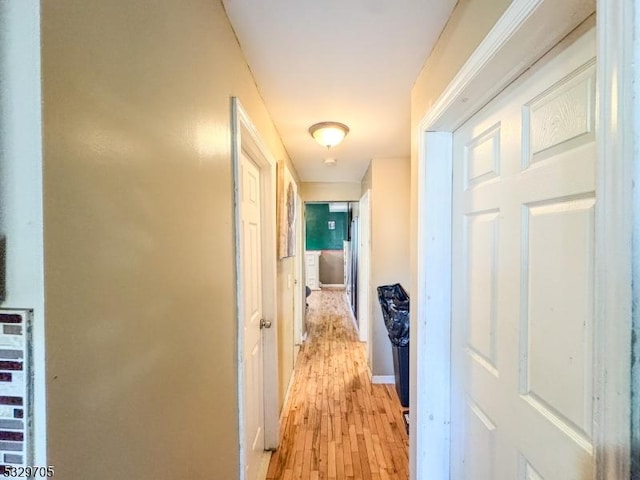 corridor featuring light hardwood / wood-style floors