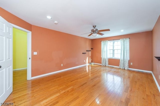 unfurnished room with light hardwood / wood-style floors and ceiling fan