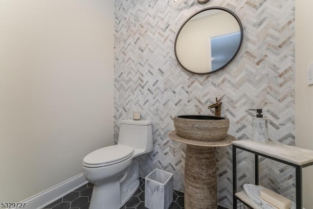 bathroom with tile patterned floors and toilet