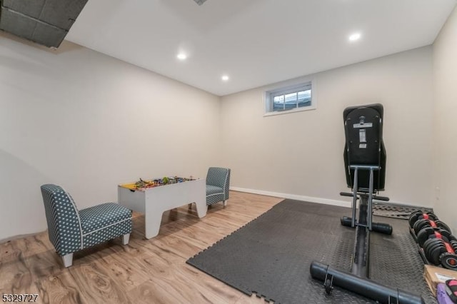 workout area with light wood-type flooring