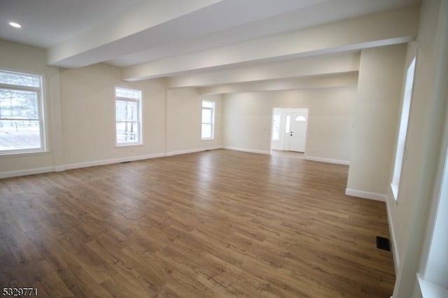 spare room featuring dark wood-type flooring