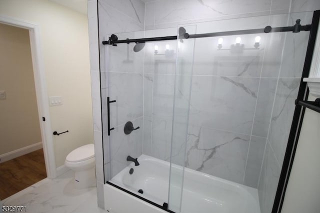 bathroom with enclosed tub / shower combo and toilet