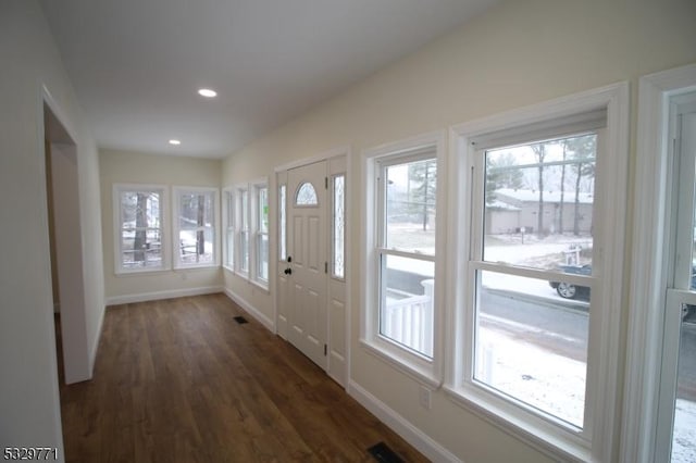 entrance foyer featuring recessed lighting, visible vents, dark wood finished floors, and baseboards