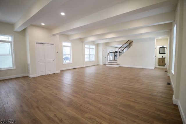 unfurnished living room with dark hardwood / wood-style flooring