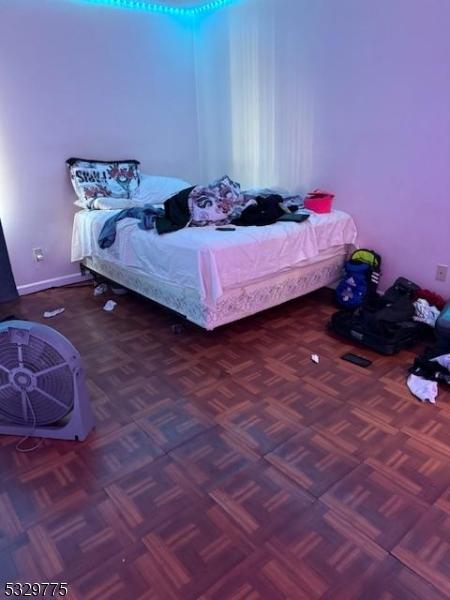 bedroom with parquet flooring