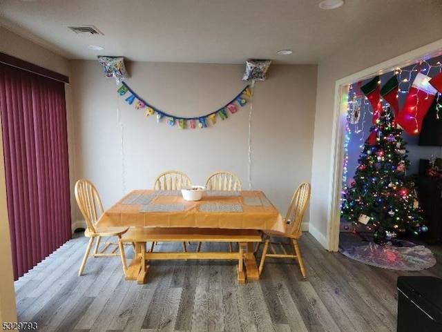 dining space featuring hardwood / wood-style flooring